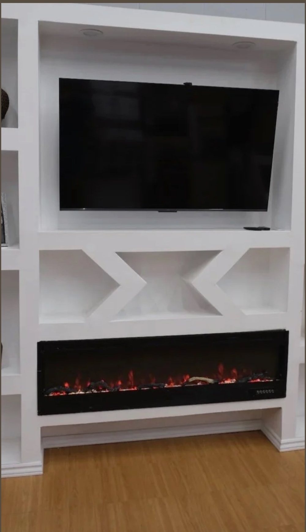 Custom media wall with marble panel, fluted wood and a mounted screen